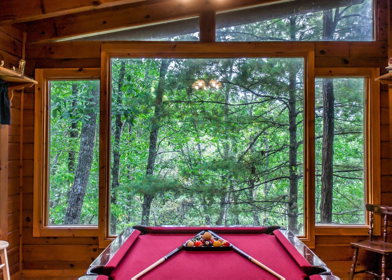The cabin boasts a pool table, providing hours of entertainment for guests of all ages.