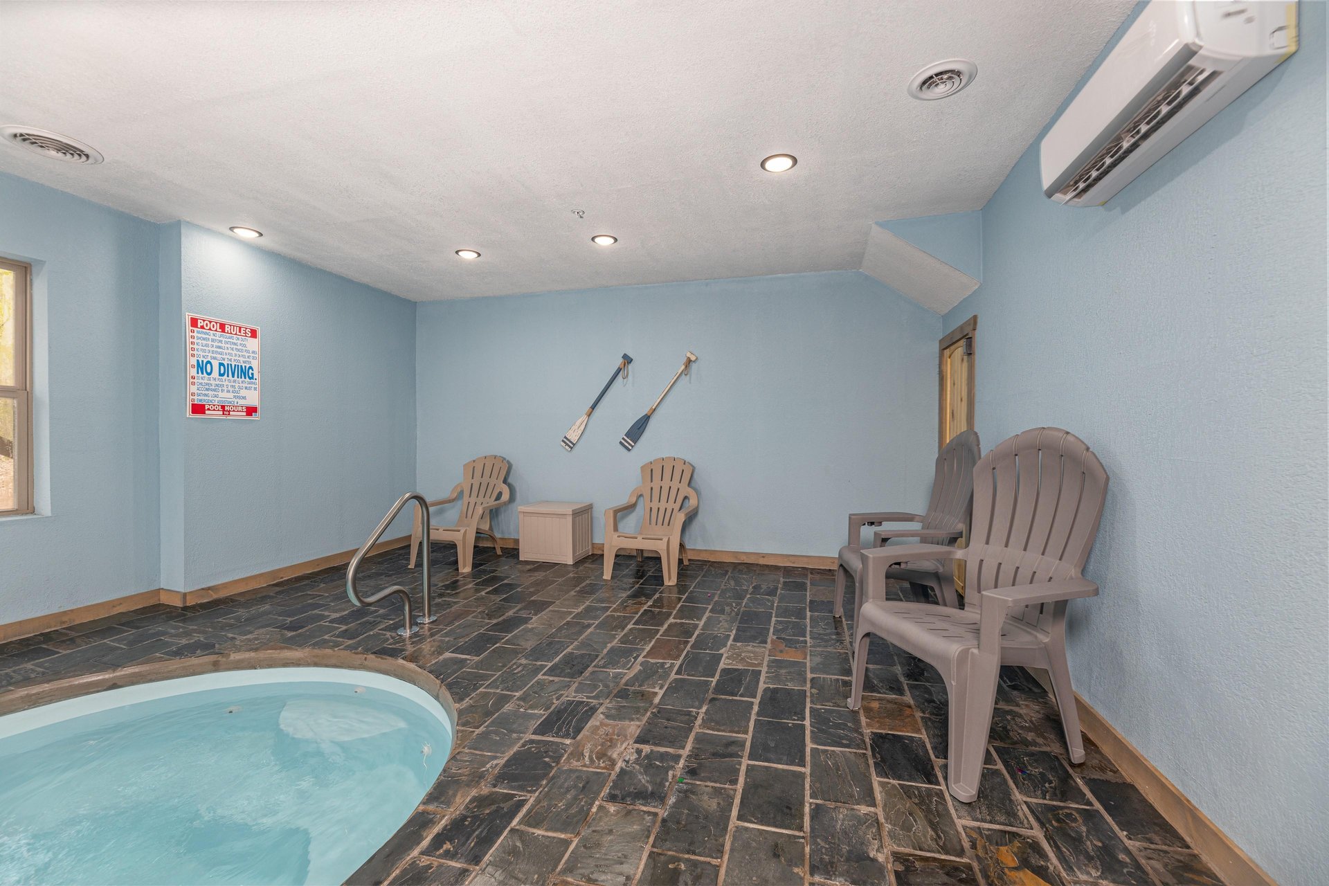 Seating and pool at Everlys Splash, a 4 bedroom cabin rental located in Pigeon Forge