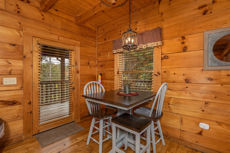 Dining table for four at Livin Simple, a 2 bedroom cabin rental located in Pigeon Forge