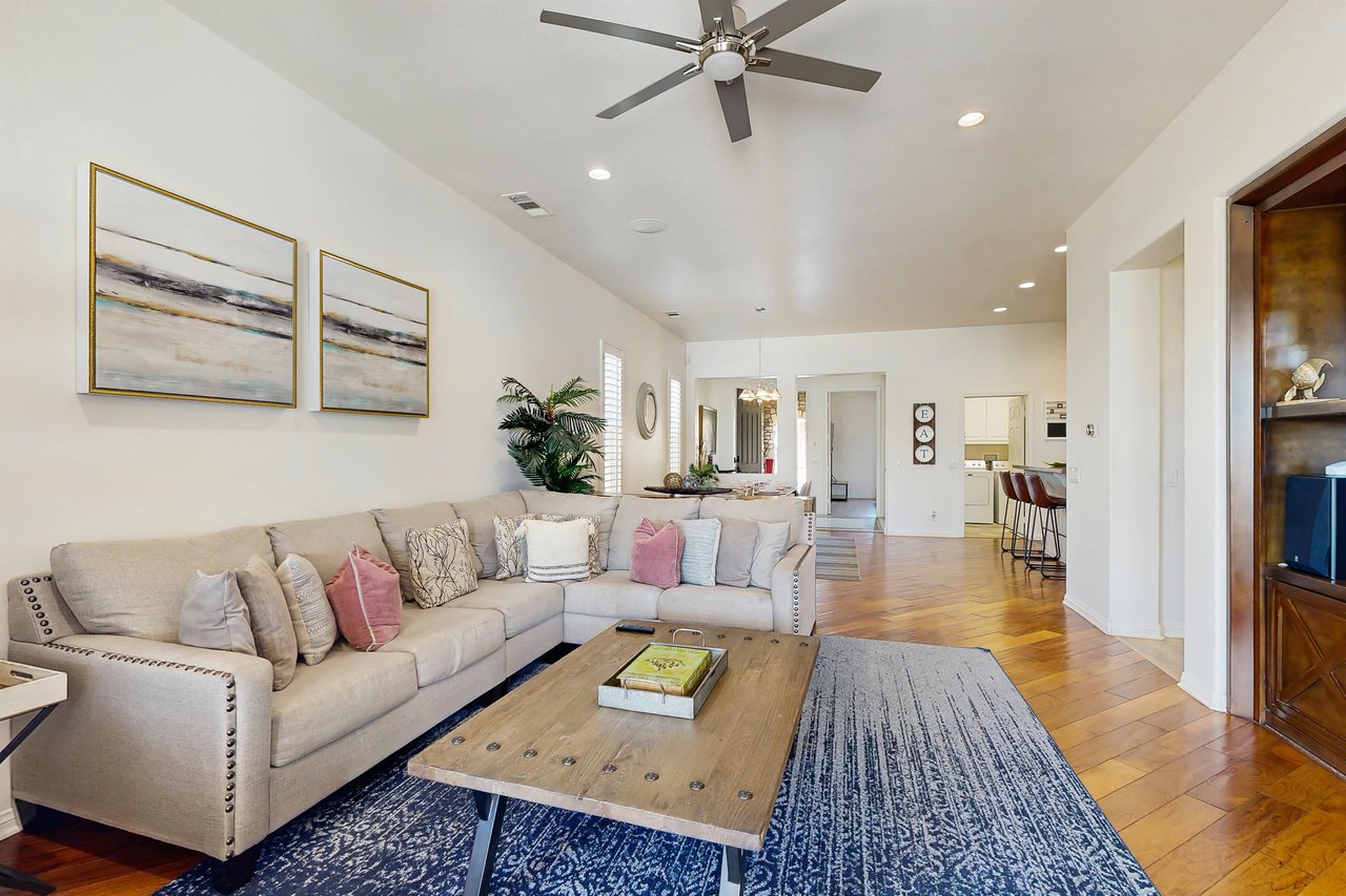 Equipped with central heating and air, ceiling fans, and openconcept living space.