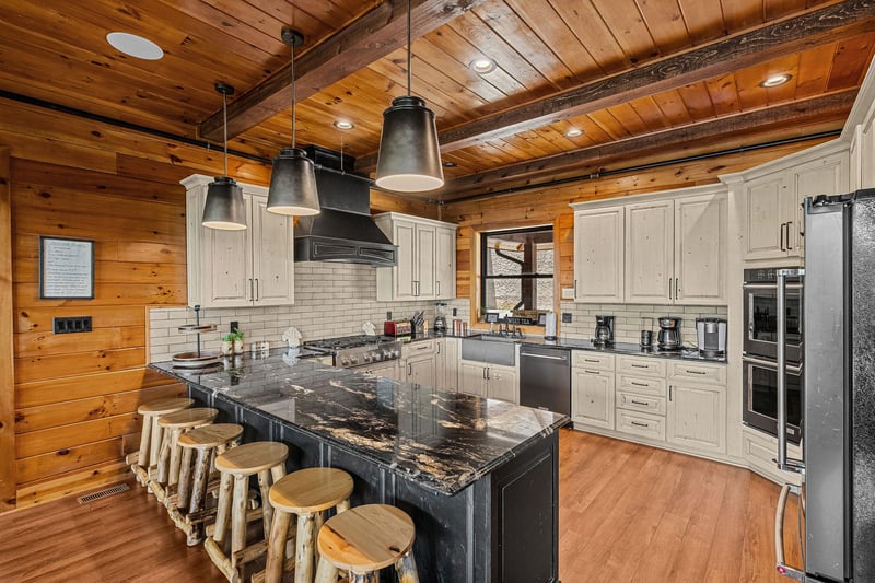 Kitchen with full size appliances and breakfast bar