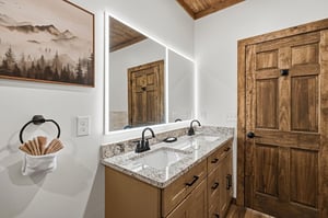 Refresh in your beautifully appointed bathroom with granite countertops, dual sinks, and rustic mountain charm.