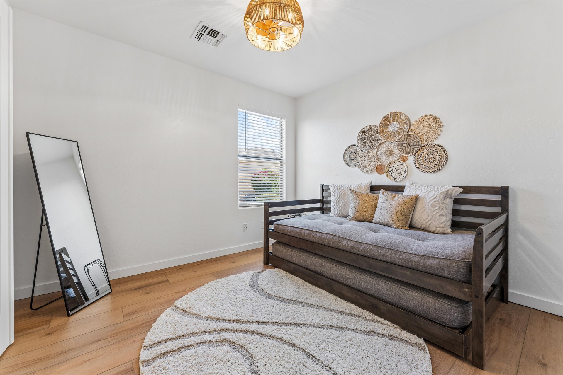 Located just off the living room. Twin bed with twin trundle bed.