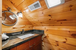 single vanity with oval mirror