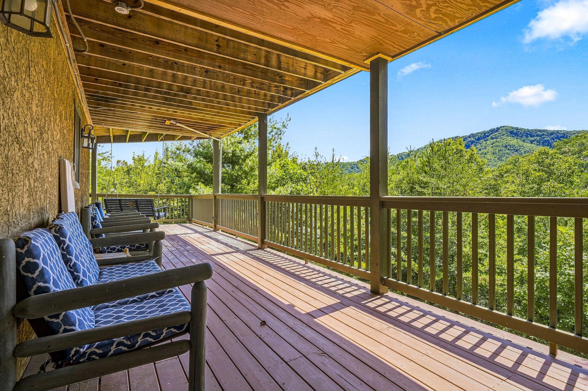 Relax on your private covered deck with seating and take in the lush mountain scenery. Fresh air, peaceful views, and the perfect spot to unwind after exploring the area.