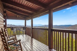 Relax on your private covered deck with stunning mountain views, perfect for morning coffee or evening unwind.