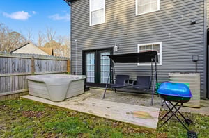 Relax in your private hot tub after grilling on the deck, complete with porch swing for peaceful moments.