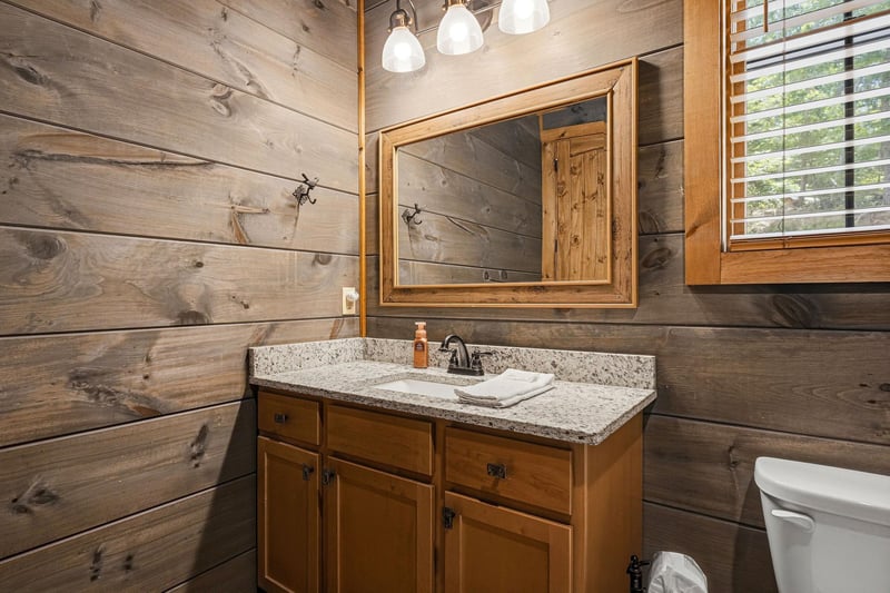 Rustic wooden walls and granite countertops create a cozy, cabininspired retreat where you can unwind and refresh after your adventures.