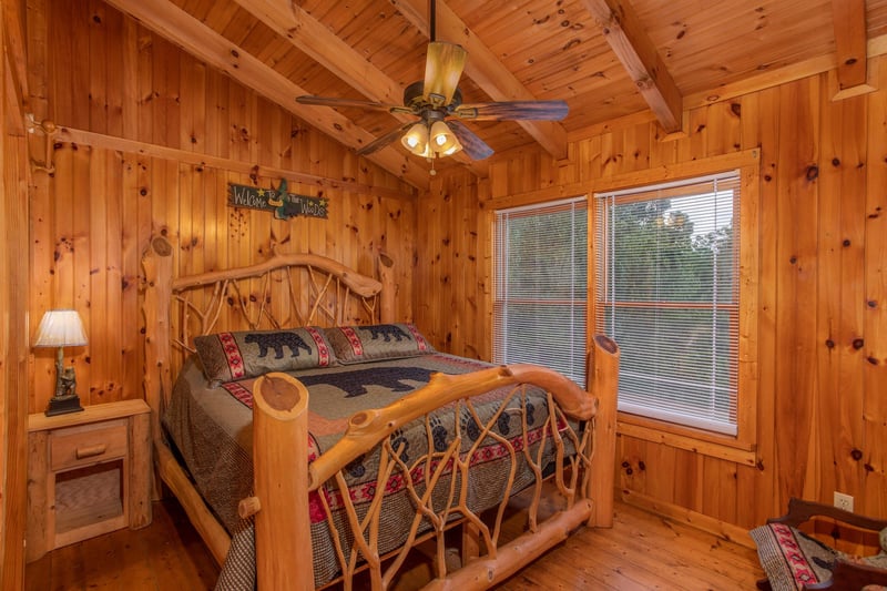 King bed by window and nighstand