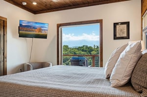 Wake up to stunning mountain views framed by your bedrooms private balcony, where every morning feels like a fresh escape into nature.