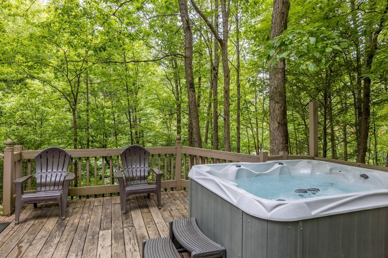 Hot tub on the deck at Heavenly Hideaway, a 2bedroom cabin rental located in Gatlinburg
