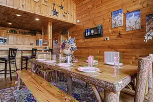 Gather around this stunning log dining table where your group creates lasting memories over hearty meals and laughter.
