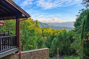 Step onto your private balcony and take in sweeping mountain vistas framed by lush forest. Breathe in the fresh air and savor peaceful moments against this stunning natural backdrop.