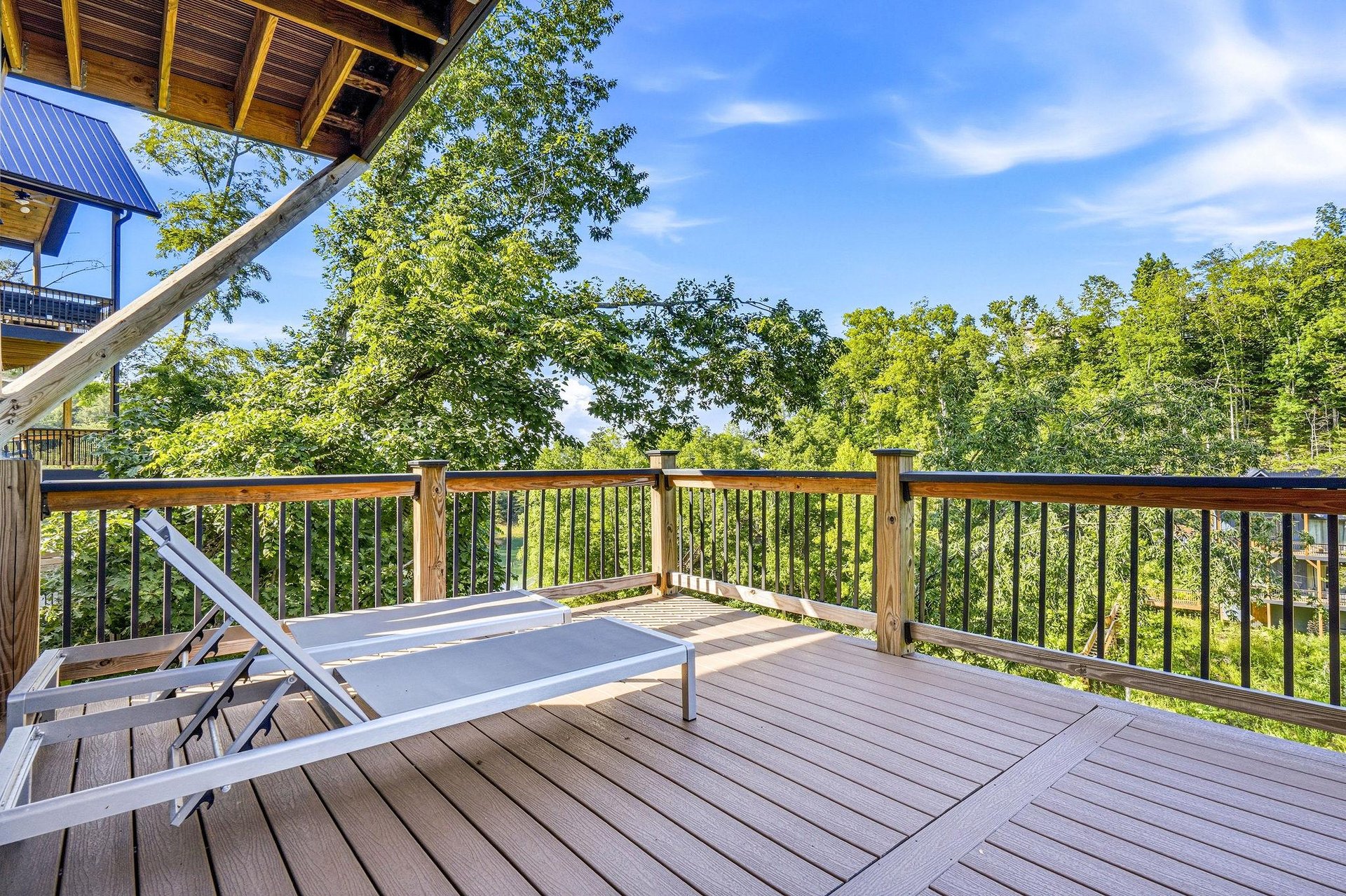 Unwind on your private deck surrounded by lush forest views, perfect for morning coffee or peaceful afternoons soaking in natures beauty.