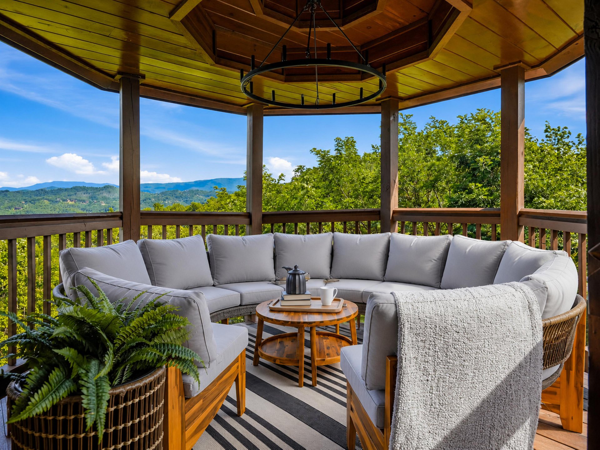 Imagine mornings with coffee here—soft cushions cradle you as rolling mountains stretch to the horizon. The gazebos warmth and mountain breezes create your perfect retreat.