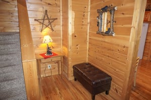 Bench in the foyer at Bearly Mine, a 1bedroom cabin rental located in Pigeon Forge