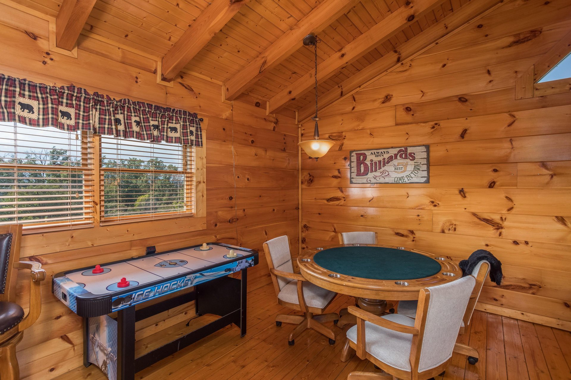 Air hockey  card table in the game loft at Graceland, a 4bedroom cabin rental located in Pigeon Forge