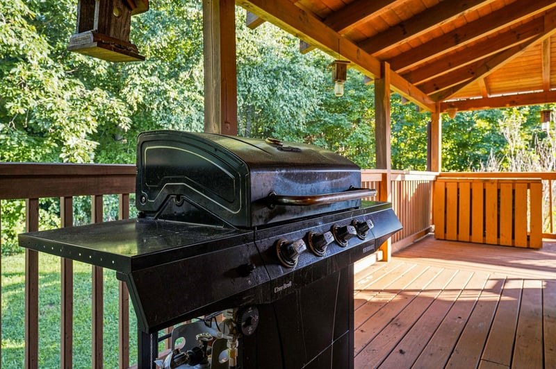 Fire up the grill on your covered deck and savor a meal surrounded by lush forest views and warm natural wood.
