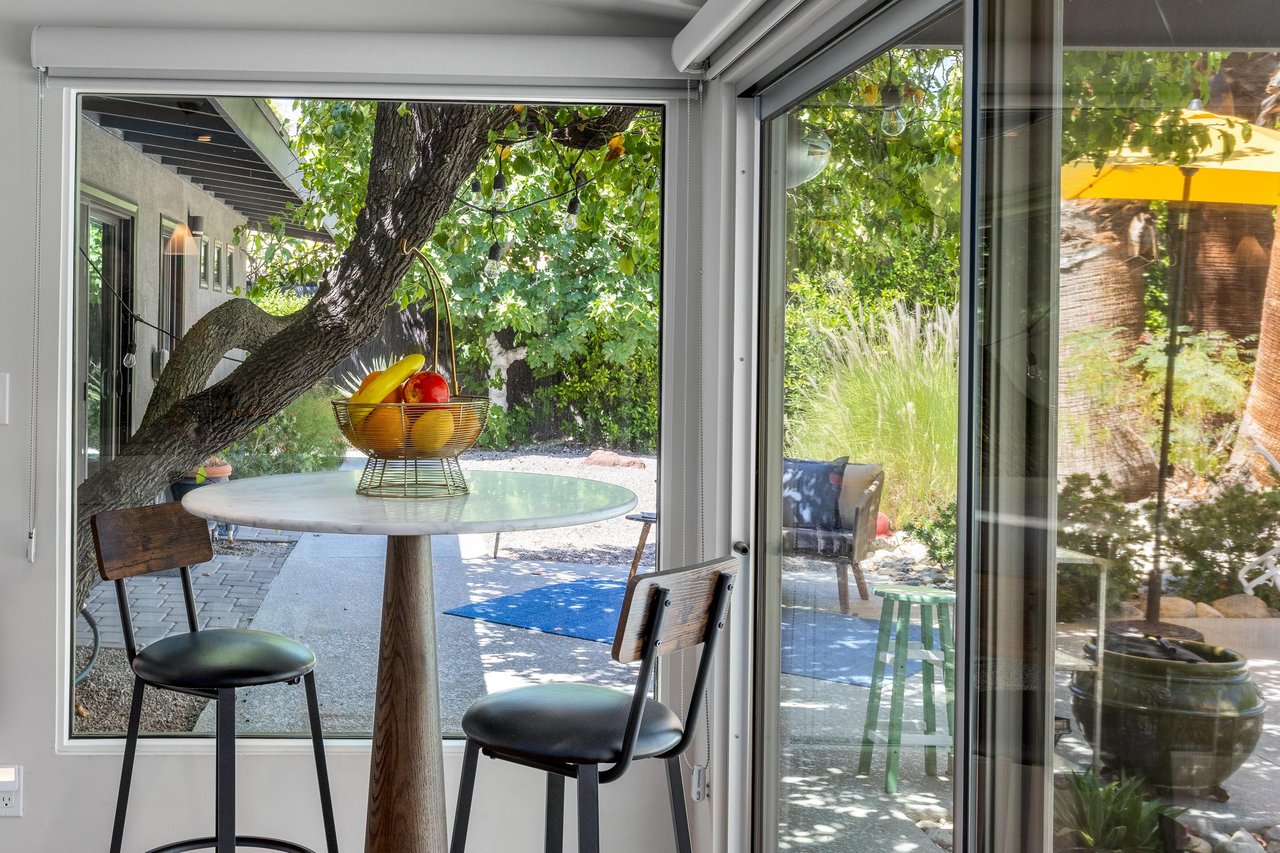 Hightop seating overlooking the back patio, the perfect place for morning coffee