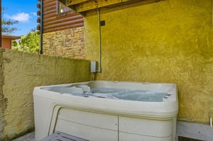 Unwind in your private hot tub, tucked away in a secluded corner where warm bubbles and peaceful moments await your relaxation.