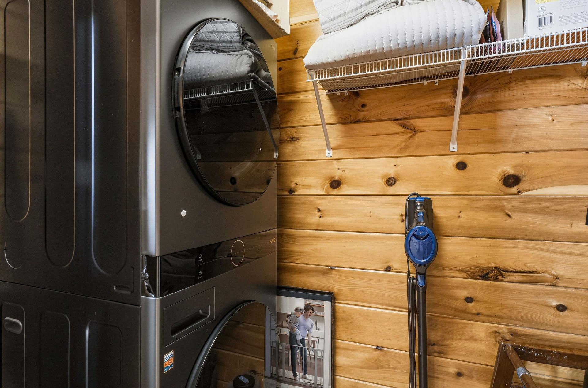 Convenient laundry setup keeps your clothes fresh during your stay. Fullsize washer and dryer with organized storage above.
