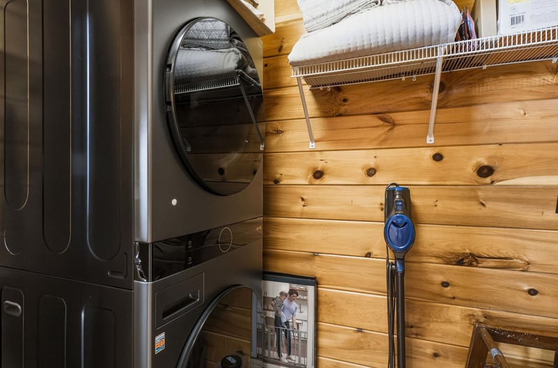 Convenient laundry setup keeps your clothes fresh during your stay. Fullsize washer and dryer with organized storage above.