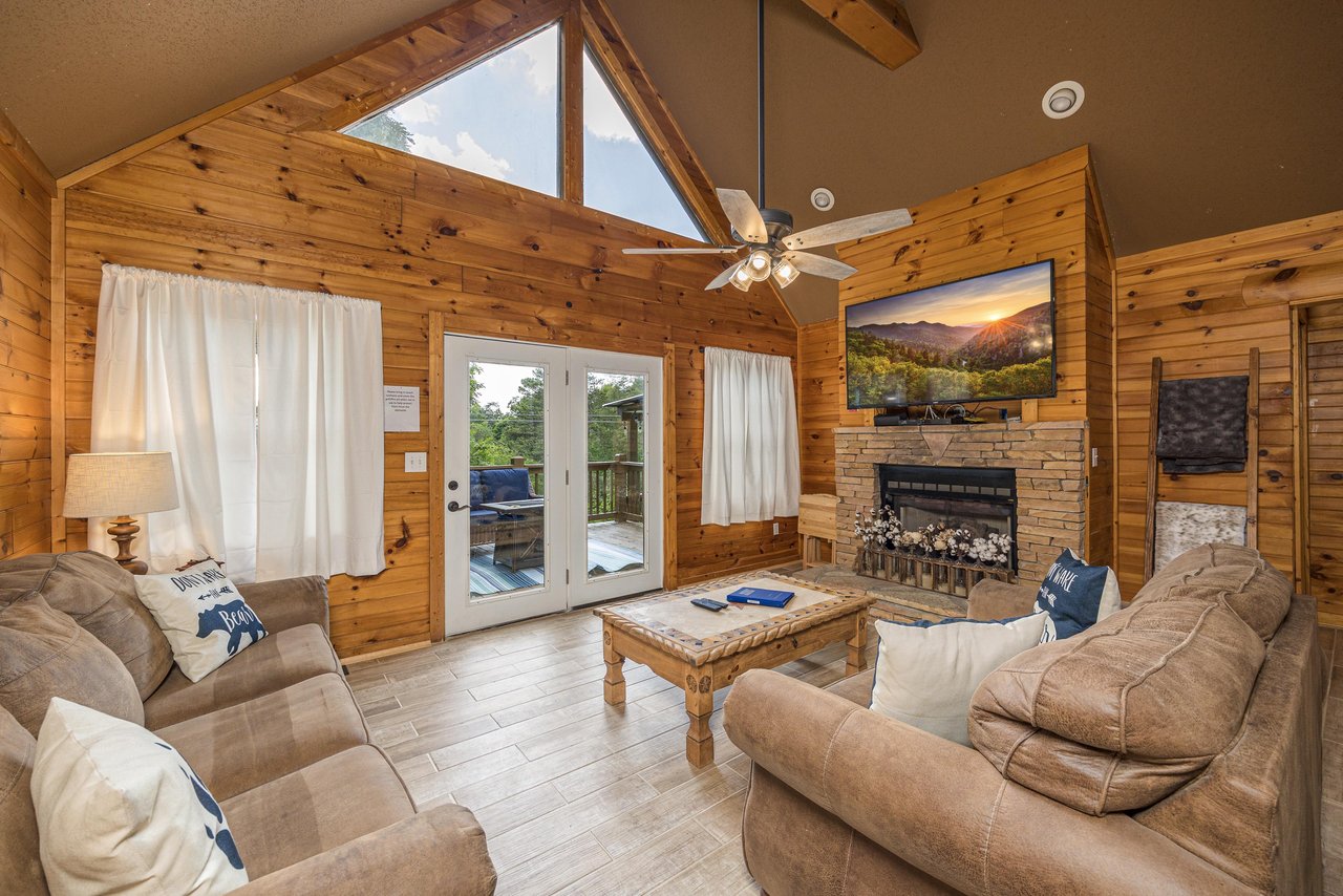 Living room with stone fireplace