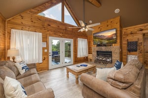 Living room with stone fireplace