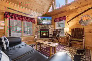 Cozy up by the crackling fireplace in your rustic cabin living room, where plaid touches and warm wood create the perfect mountain retreat atmosphere.