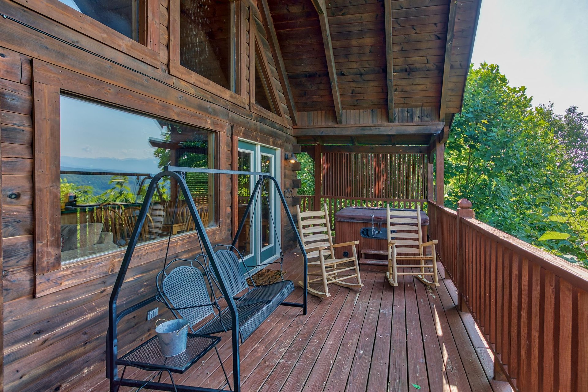 porch swing on a covered deck at angels majestic view a 3 bedroom cabin rental located in pigeon forge