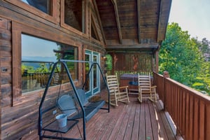 porch swing on a covered deck at angels majestic view a 3 bedroom cabin rental located in pigeon forge