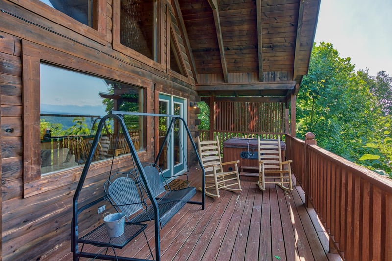 porch swing on a covered deck at angels majestic view a 3 bedroom cabin rental located in pigeon forge