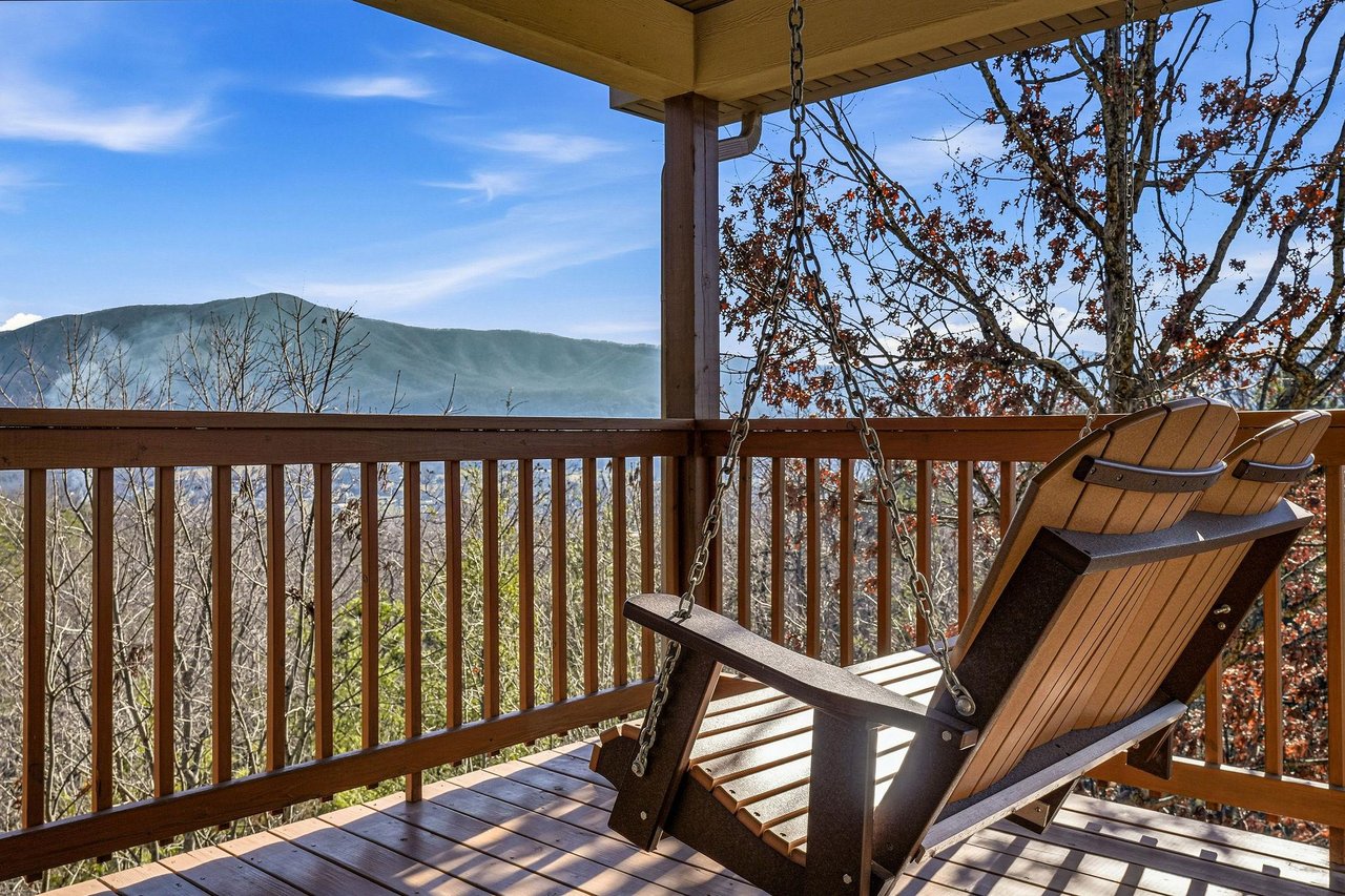 Unwind on your private deck with stunning mountain views stretching to the horizon, perfect for morning coffee or evening relaxation.