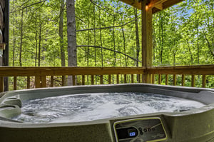Slip into your private hot tub and soak up the peaceful forest views. The warm water and lush greenery create the perfect escape for unwinding after a day of adventure.