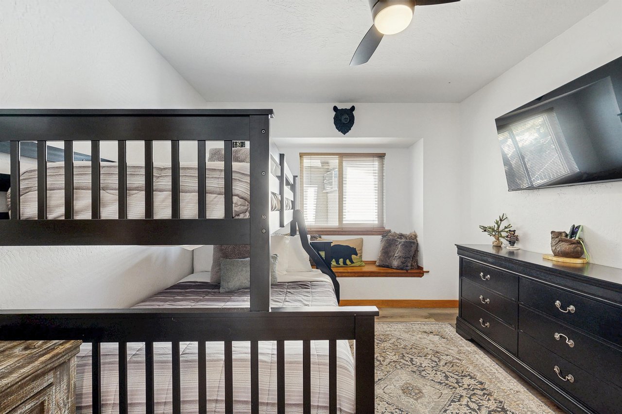 Twin over full bunk beds and smart TV.
