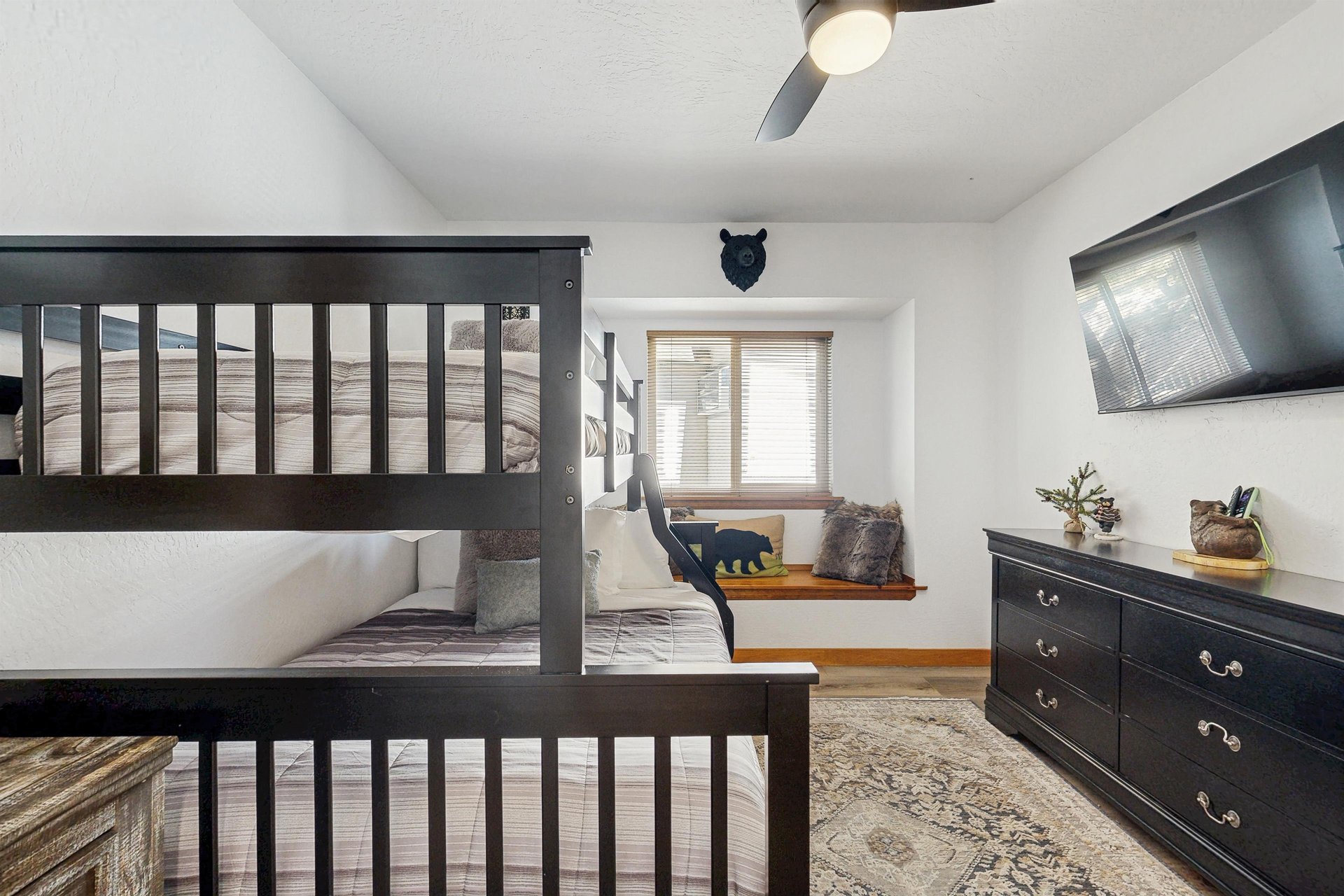Twin over full bunk beds and smart TV.