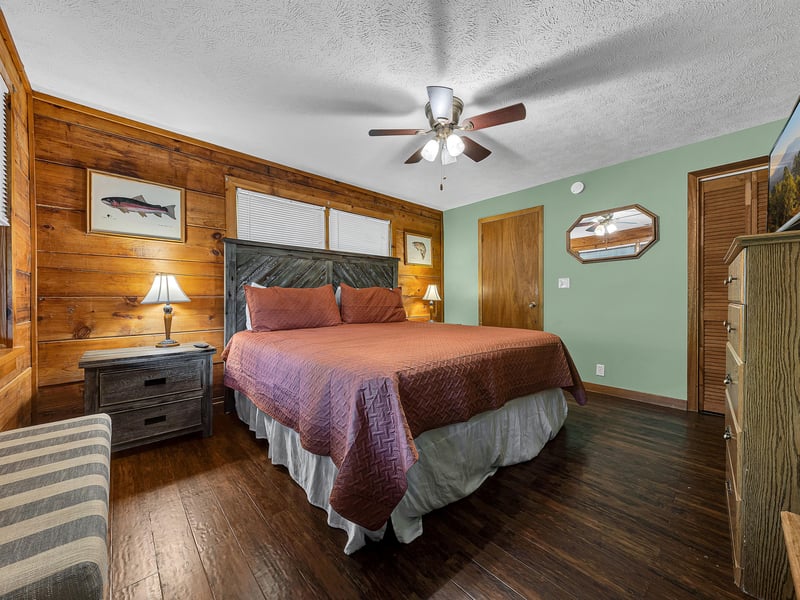 Unwind in your cozy bedroom featuring rustic wood accents, comfortable bedding, and thoughtful decor that creates the perfect retreat for restful nights.