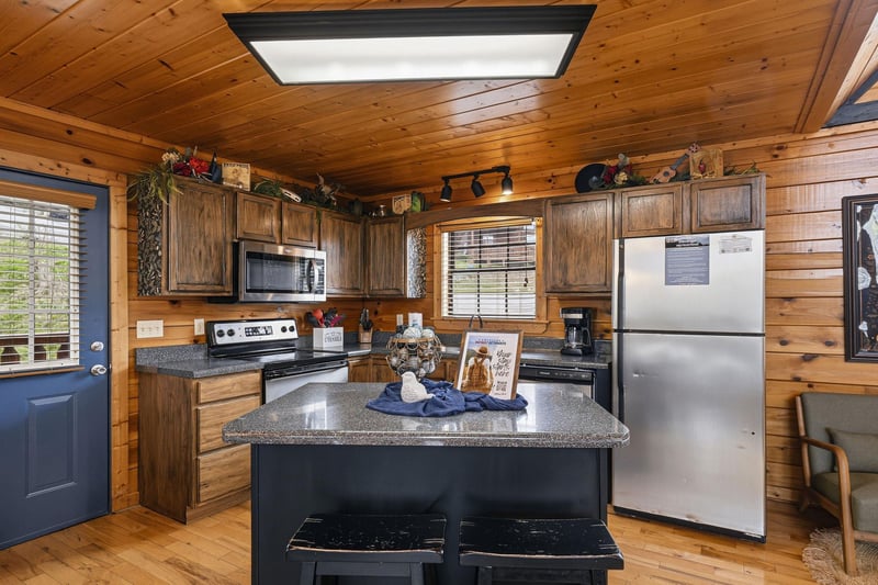 Gather around your fullyequipped cabin kitchen, where rustic wood meets modern convenience for memorable meal prep together.