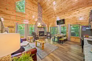 OPEN CONCEPT with a fireplace, sofa bed, dining, natural lighting  views