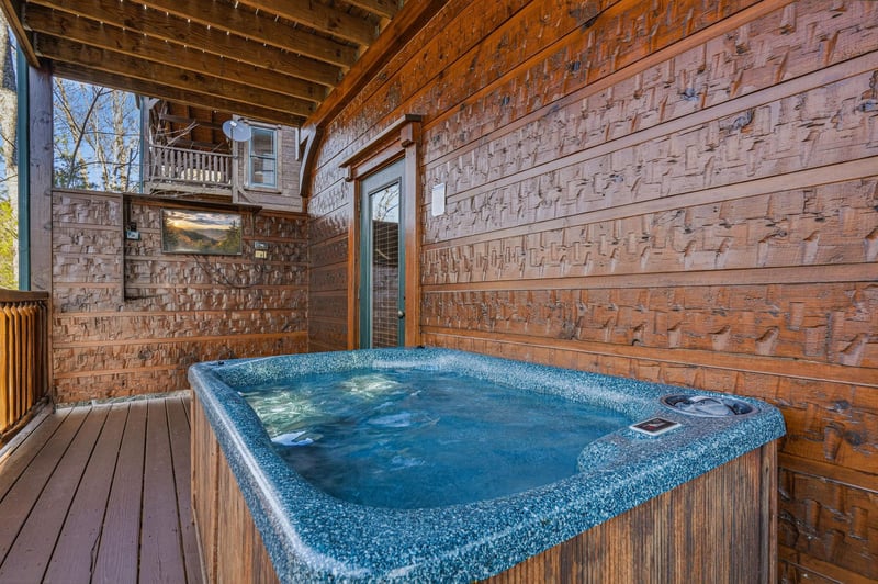 Soak your cares away in your private hot tub, nestled on a covered deck surrounded by warm wood and peaceful mountain air—a perfect retreat after a day of adventure.