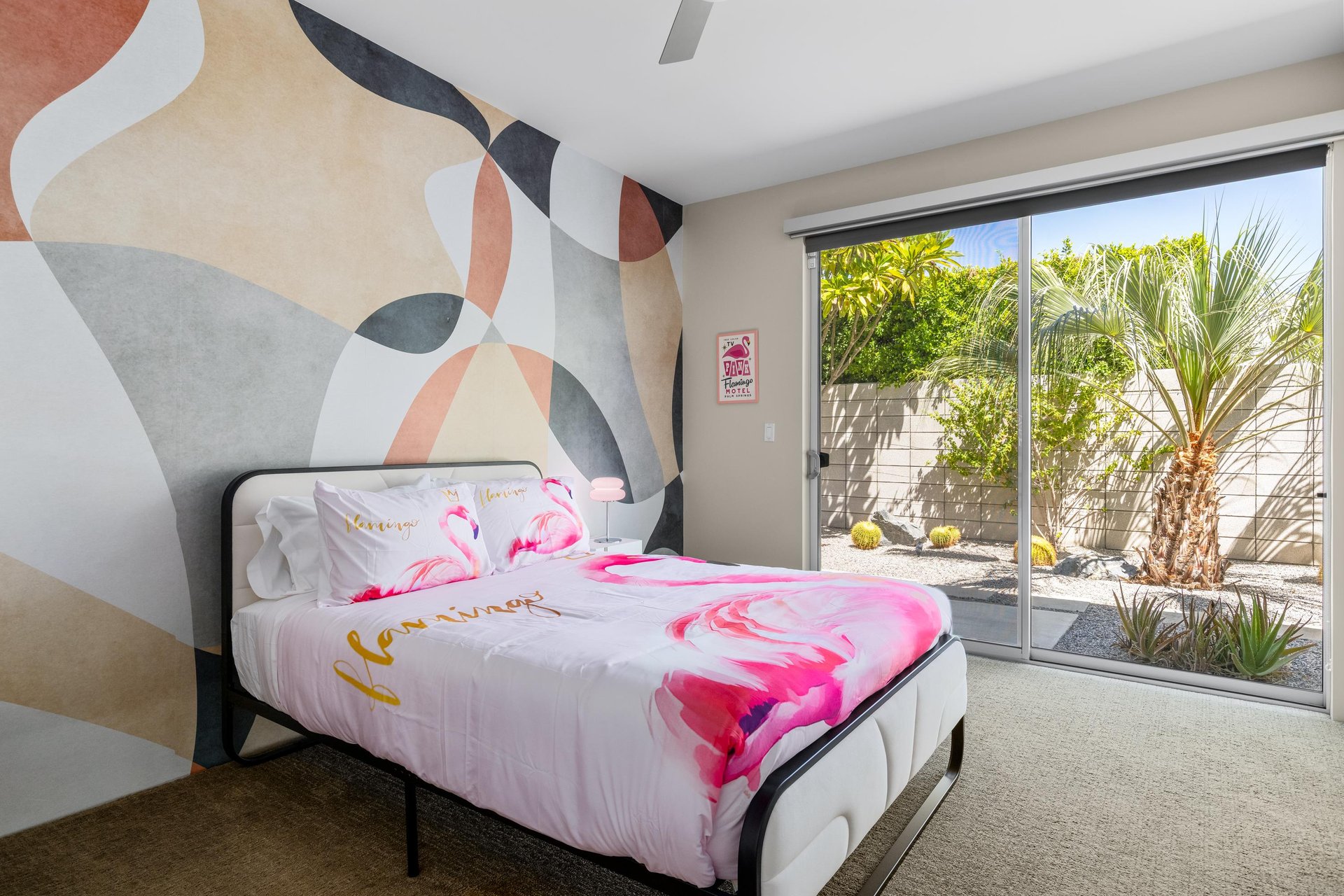 Queen size bed, plenty of natural lighting, access to the outdoor space, and jackandjill bathroom shared with other guest bedroom.