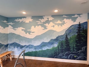 Unwind in your peaceful space featuring a stunning mountain landscape mural that brings natures tranquility indoors.