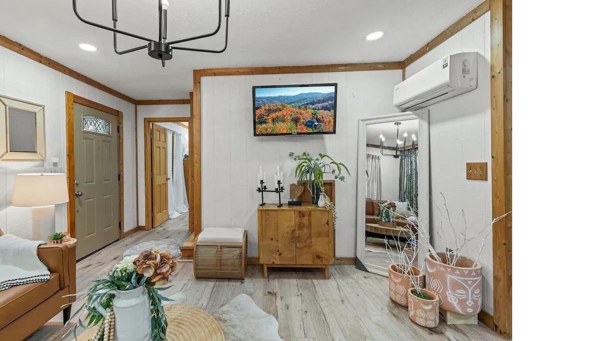 Unwind in your cozy living space featuring warm wood accents, modern amenities, and thoughtful decor that creates the perfect homeawayfromhome atmosphere.