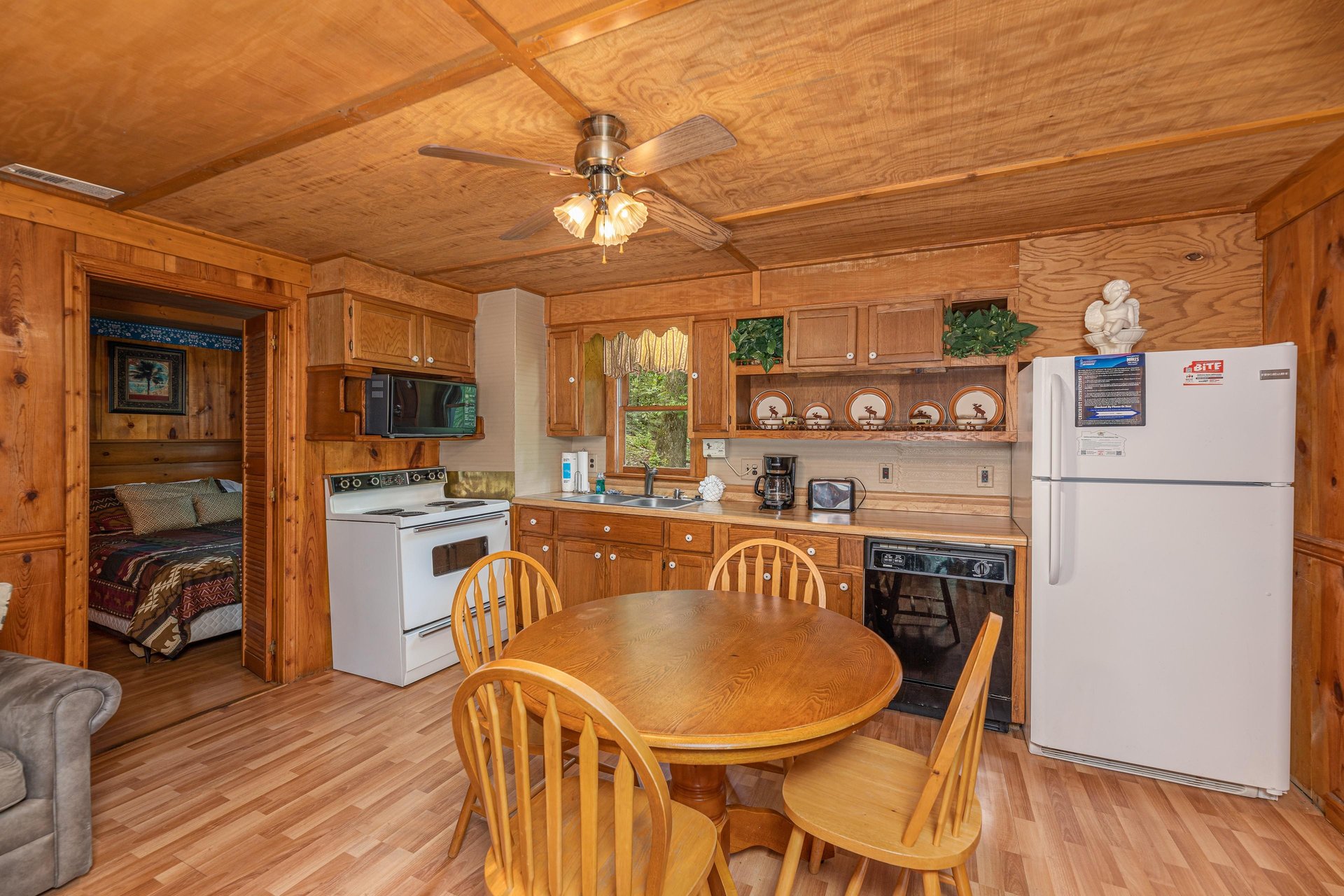 Dining room and kitchen at Heavenly Hideaway, a 2bedroom cabin rental located in Gatlinburg