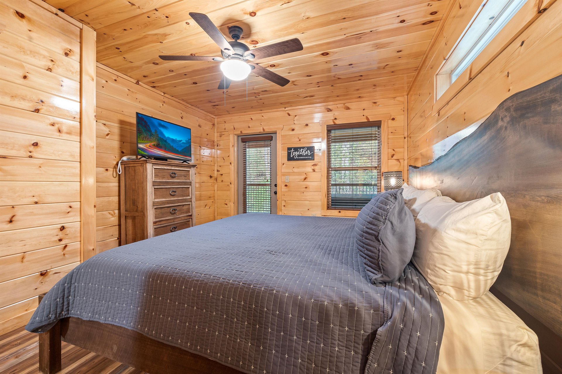 King bed with window and door to deck