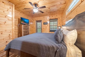 King bed with window and door to deck