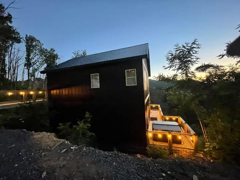 Back of Above the Clouds with hot tub and lighted deck