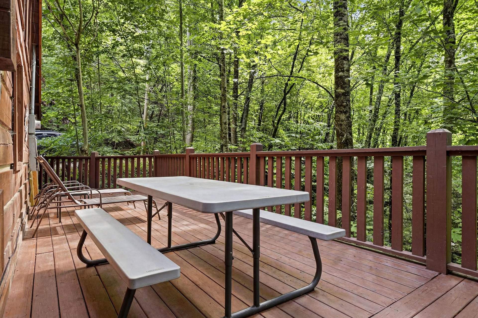 A peaceful wooded property tucked into a lush natural forest setting, offering privacy and seclusion during your mountain getaway.
