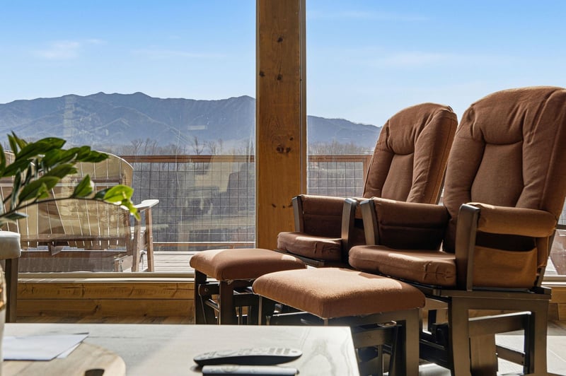 Unwind on your private terrace with panoramic mountain views, where comfortable lounge chairs await your morning coffee and evening relaxation.