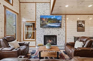 Cozy up in your mountain retreat with plush leather seating, crackling fireplace, and rustic charm.
